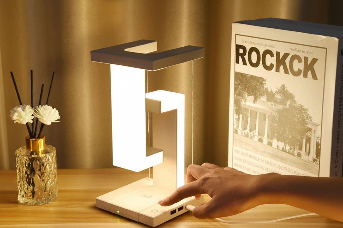 Levitating desk lamp with wireless charger by OT Lifestyle Store, showcasing a floating lamp with illuminated globe and charging pad