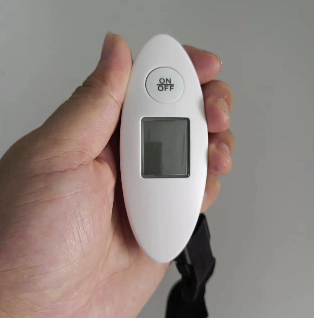 DIDA BEAR portable luggage scale with backlit display, measuring up to 88 pounds, for travel luggage weight management.