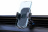 Universal car phone holder featuring gravity mount design, securely holding smartphone on dashboard.