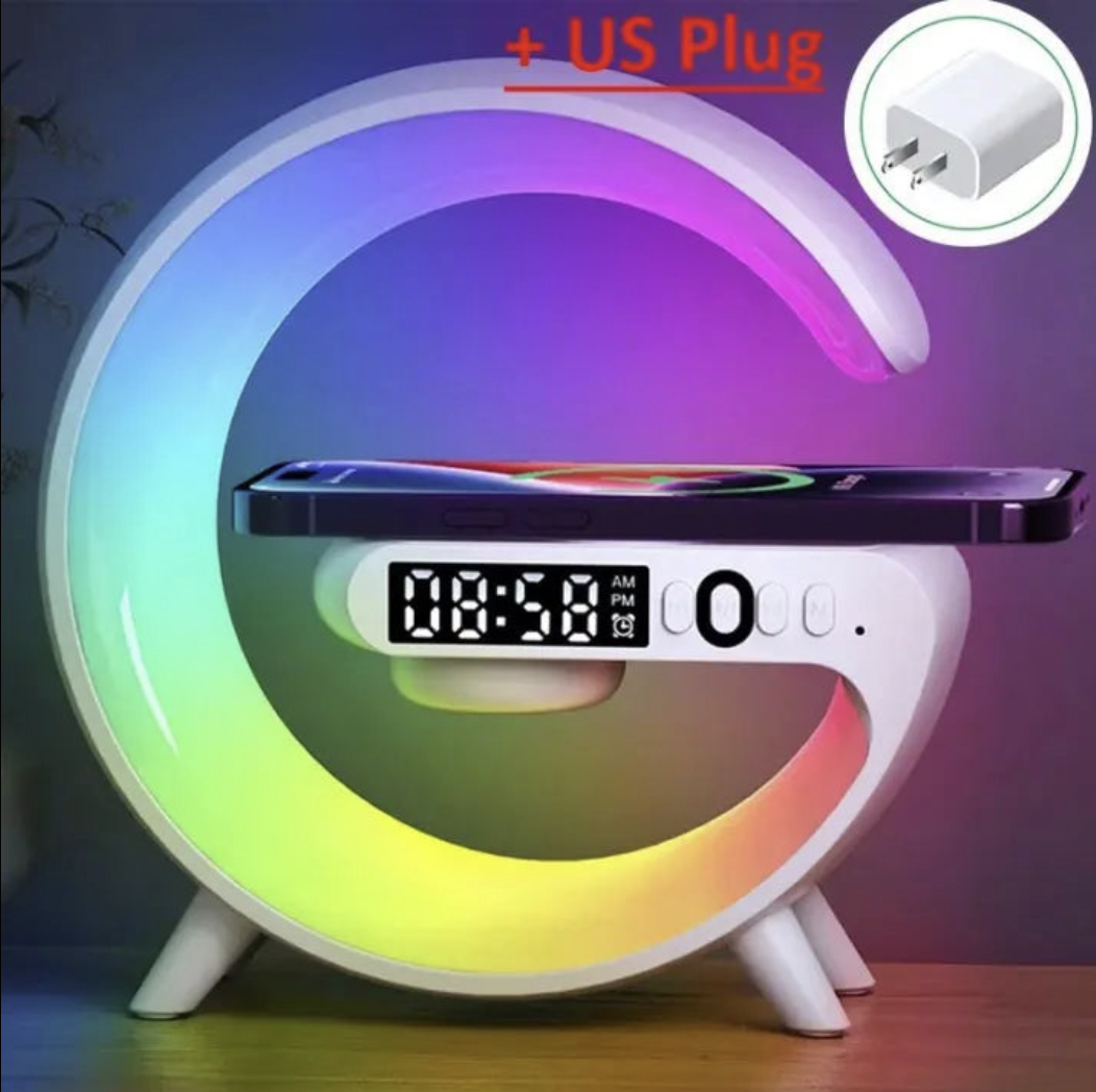 Wireless charger stand with RGB alarm clock display and Bluetooth speaker functionality, compatible with smartphones.
