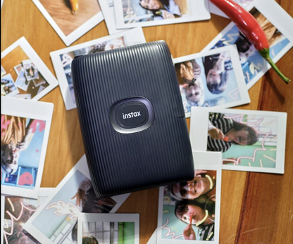 Wireless mini photo printer from Tech Viral To You Limited printing photos instantly from a smartphone.