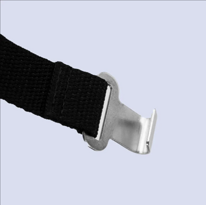 Black strap with a metal buckle on a light gray background
