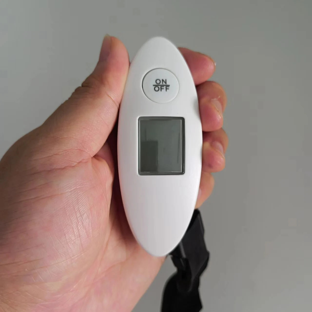 Portable DIDA BEAR luggage scale with backlit display, weighing up to 88 pounds, ideal for travel accessories and luggage management.